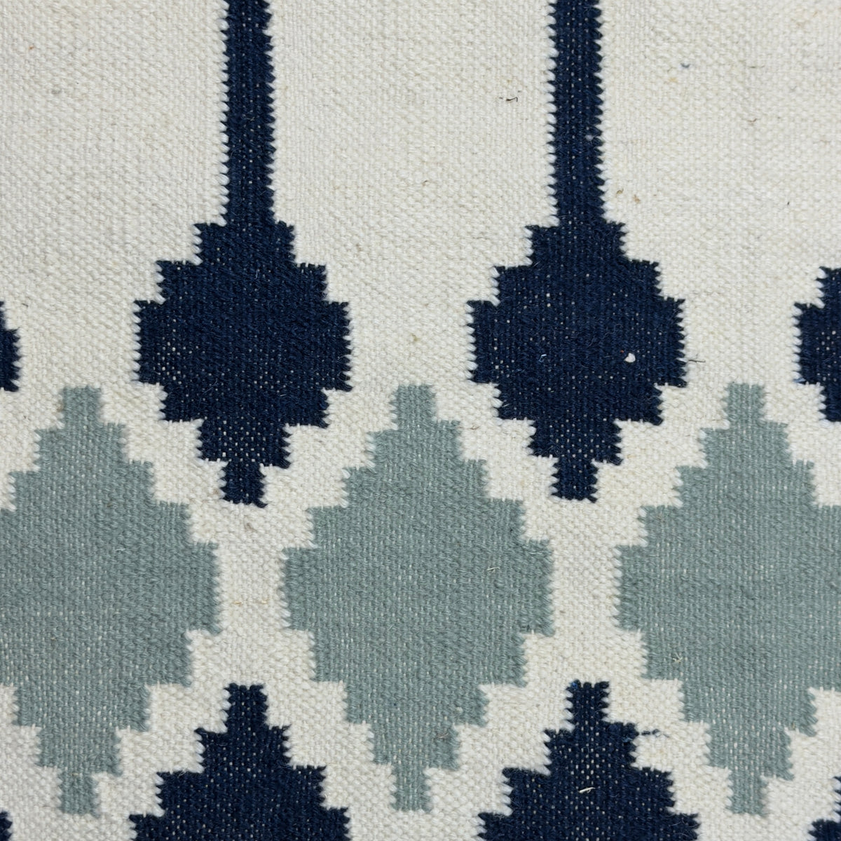 Patterned Rug with black and gray geometric design on a white background