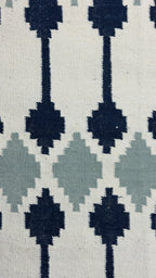 Patterned Rug with black and gray geometric design on a white background