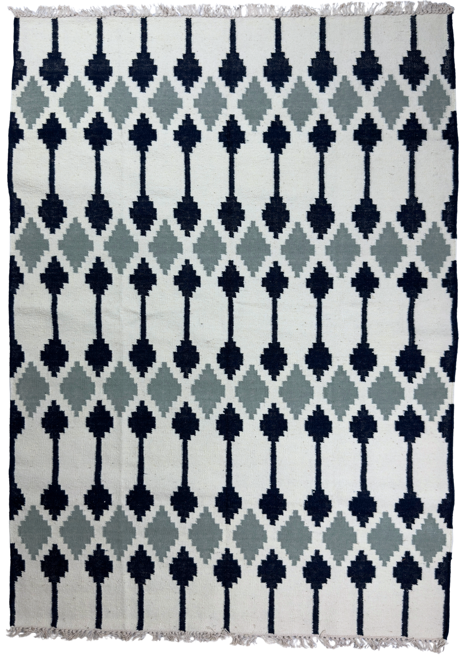 Patterned rug with geometric design on a white background