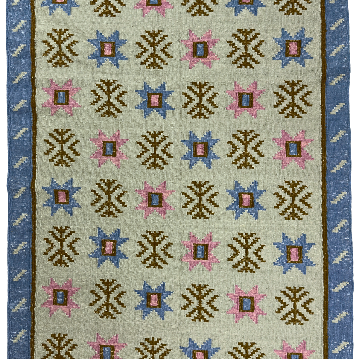 Rug with geometric pattern featuring blue, pink, and brown colors on a beige background.
