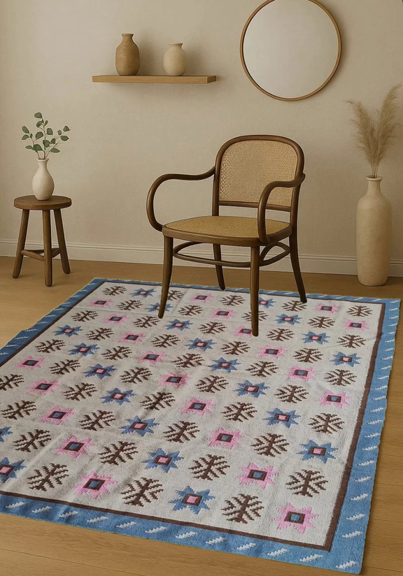 Rug with geometric pattern in a room with a chair, shelves, and vases.