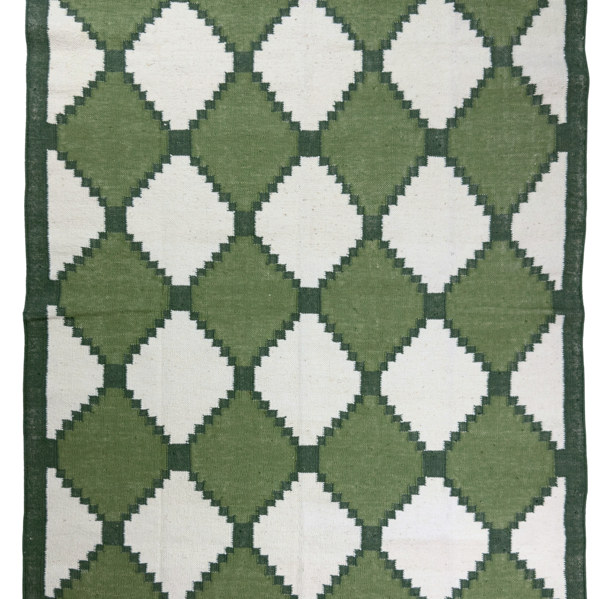 Green and white diamond patterned rug
