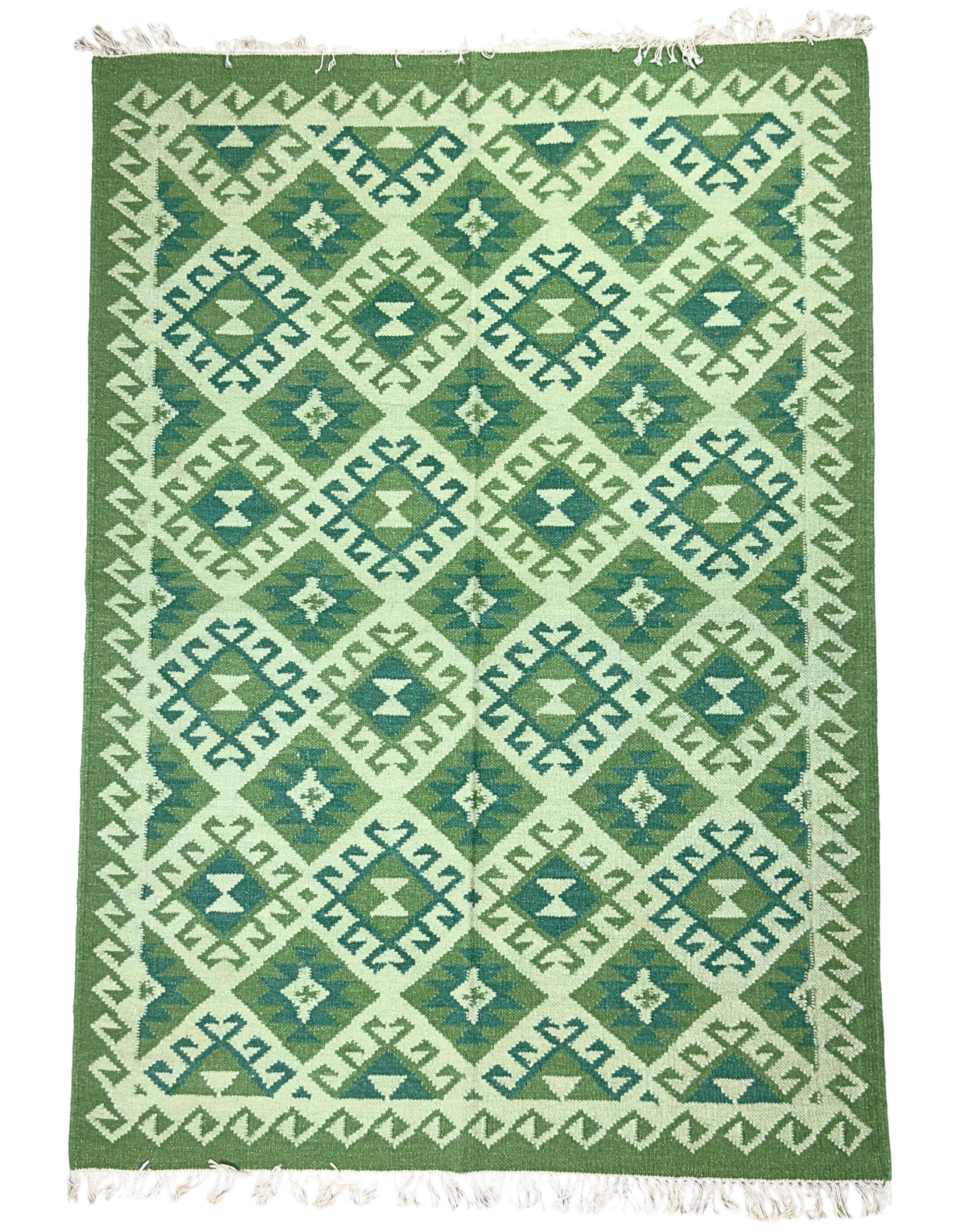 Green and white patterned rug with geometric design background