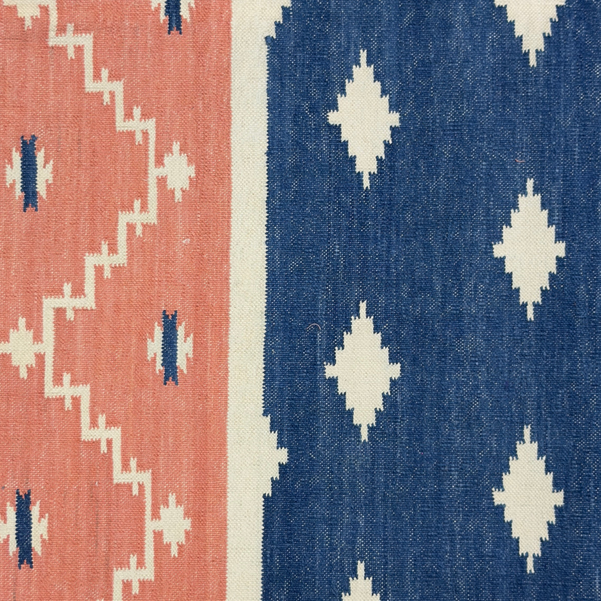 Patterned rug with red and blue geometric design