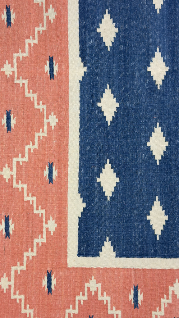 Patterned rug with red and blue geometric design