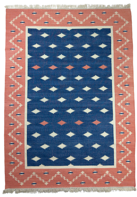 Rug with geometric pattern featuring blue, pink, and white colors