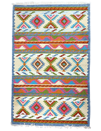 Colorful patterned rug with geometric design on a off white background