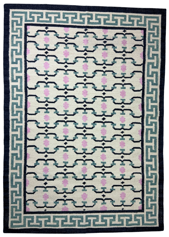 Patterned rug with geometric design on a white background