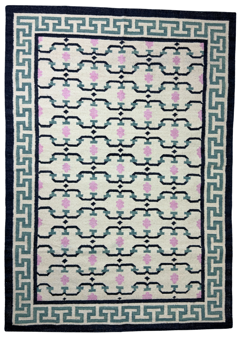Patterned rug with geometric design on a white background