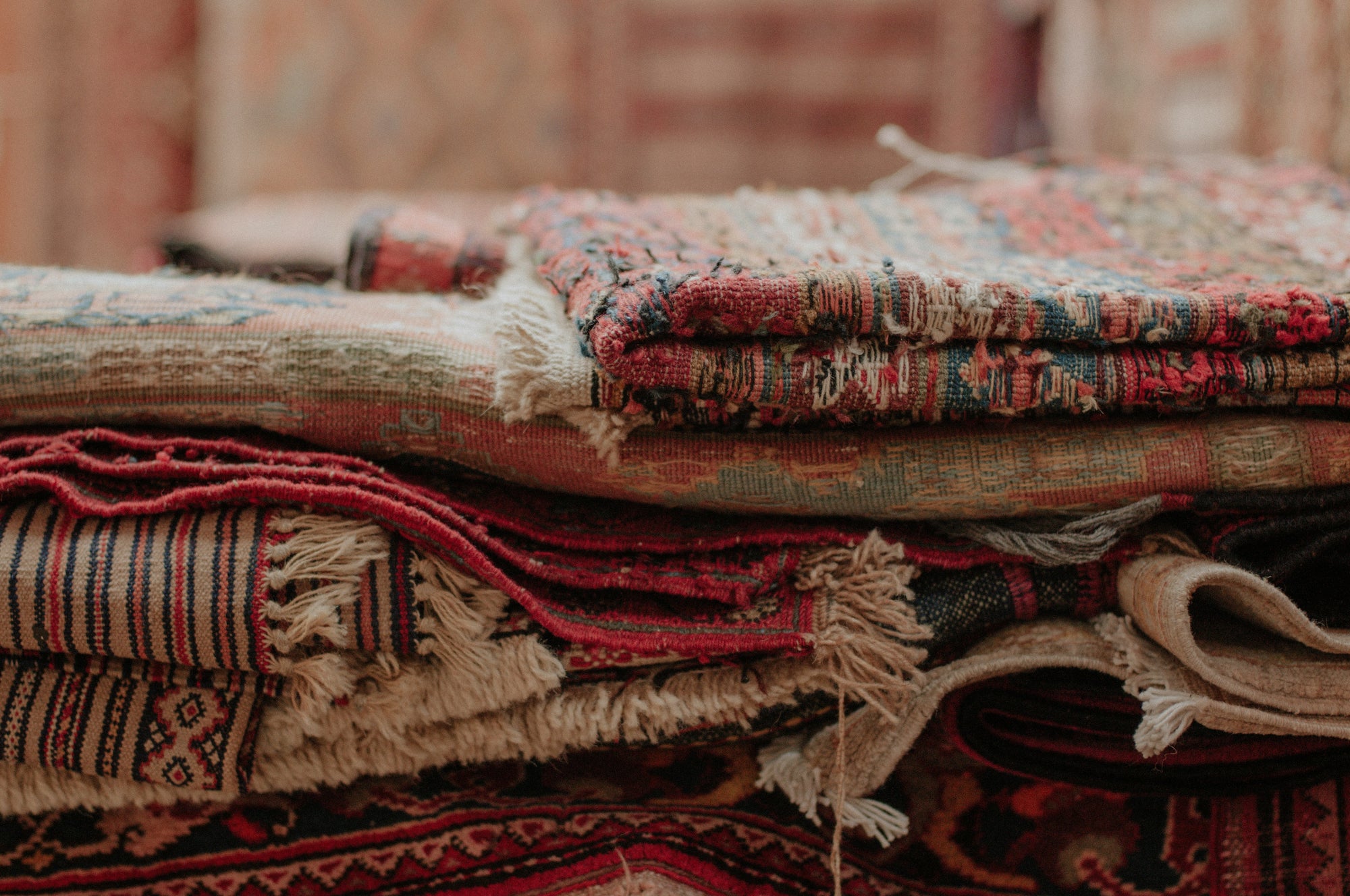 Stack of patterned rugs 