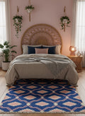 Handwoven blue and pink wool rug with bold geometric blocks by Dariyaa